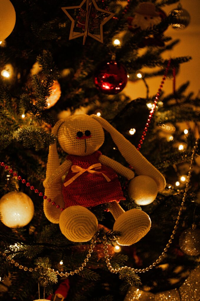 child's Christmas toy on tree -symbol of absence and love
